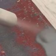 Paint stripping on a large surface with Waterblast 120 water-assisted abrasive blasting machine and OLYBLAST abrasive pre-wetted at the nozzle outlet
